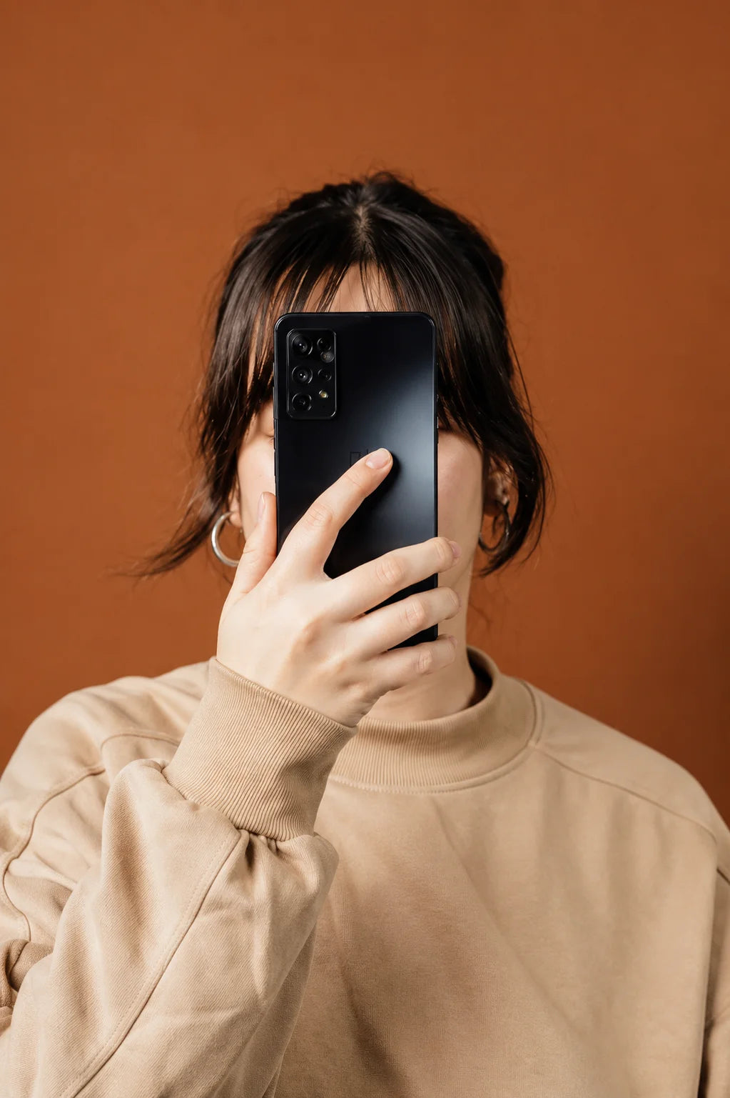 Woman holding samsung galaxy smartphone