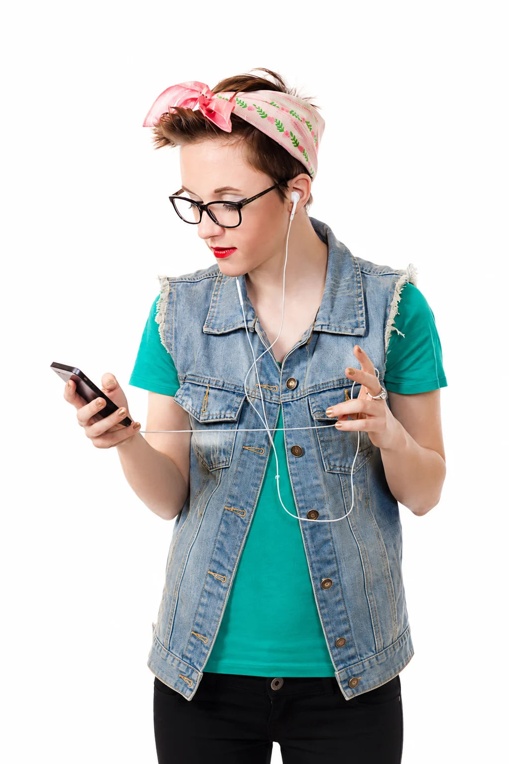 Woman using an iPhone with wired earphones